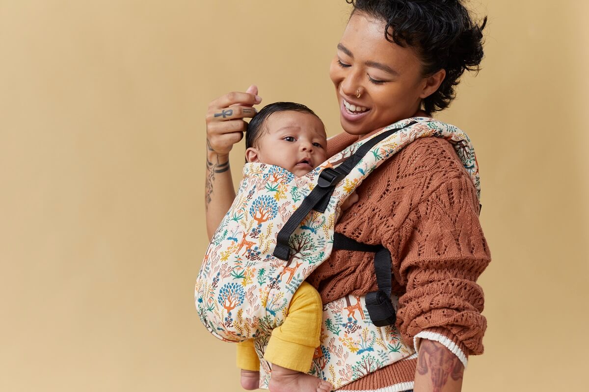 A mum with her child in a Tula Free-to-Grow Baby Carrier
