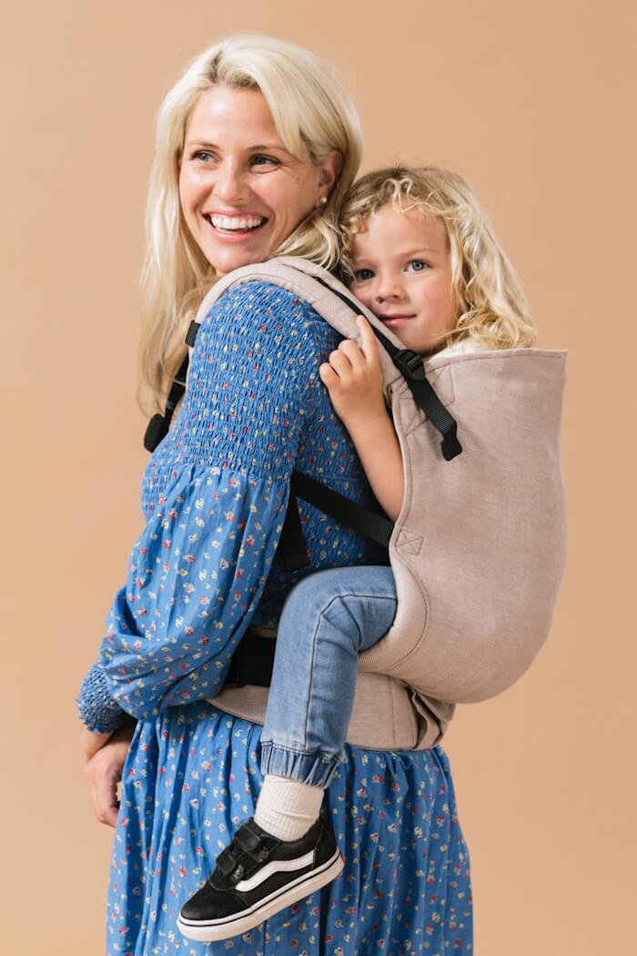 Tula Toddler Carrier Linen Sand in a neutral beige color.