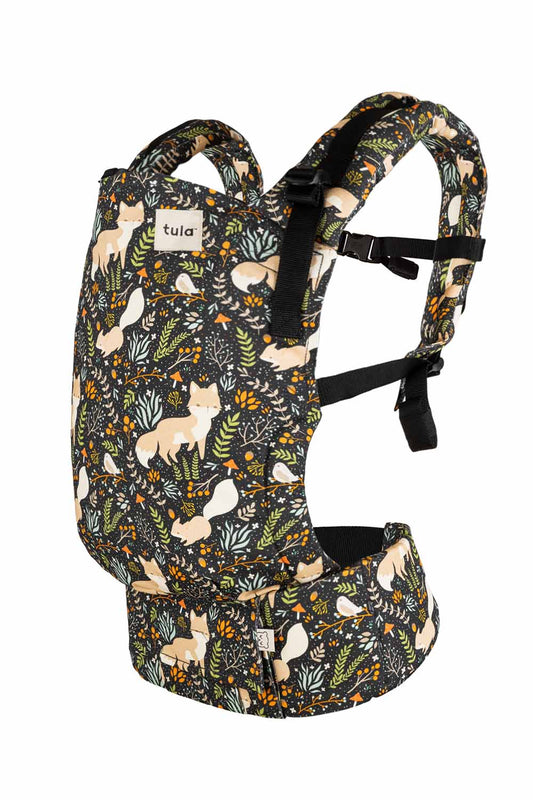 Newborn Tula Free-to-Grow Baby Carrier Fox Tail - fox pattern against green and organge foliage and brown background.