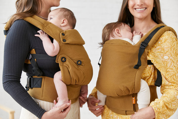 Two mums babywearing their babies in two different Tula carriers Explore and Free-to-Grow