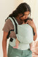 Soft green with gray undertones Tula Free-to-Grow Linen baby carrier.