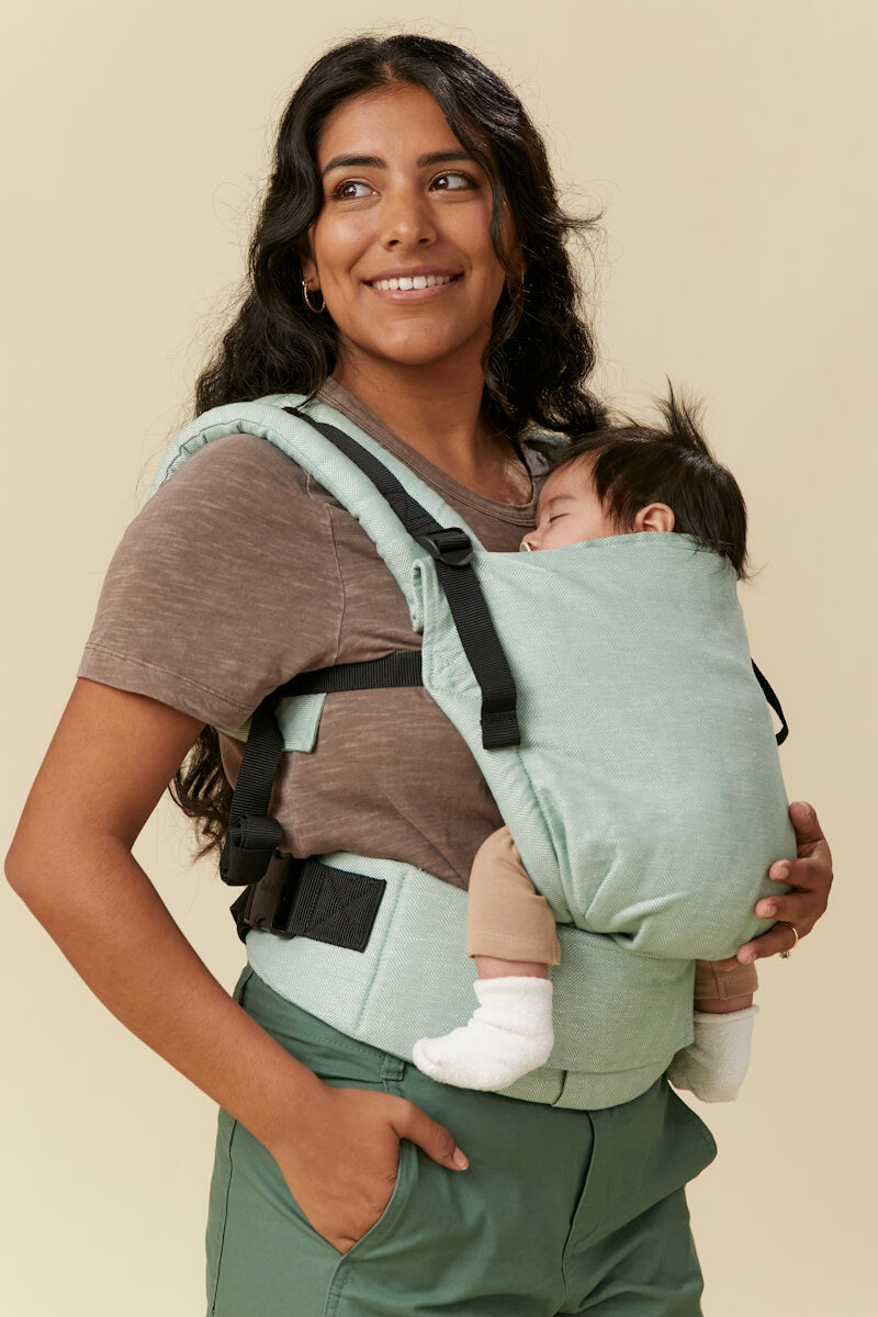 Soft green with gray undertones Tula Free-to-Grow Linen baby carrier.