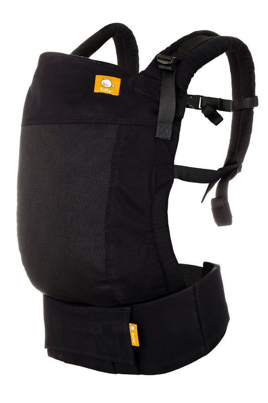 The ergonomic Free-to-Grow Baby Carrier Coast Urbanista from Tula in black.