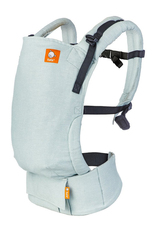 The ergonomic Free-to-Grow Baby Carrier Seafoam in a beautiful soft aqua colour inspired by sunbleached landscapes close to the ocean. 