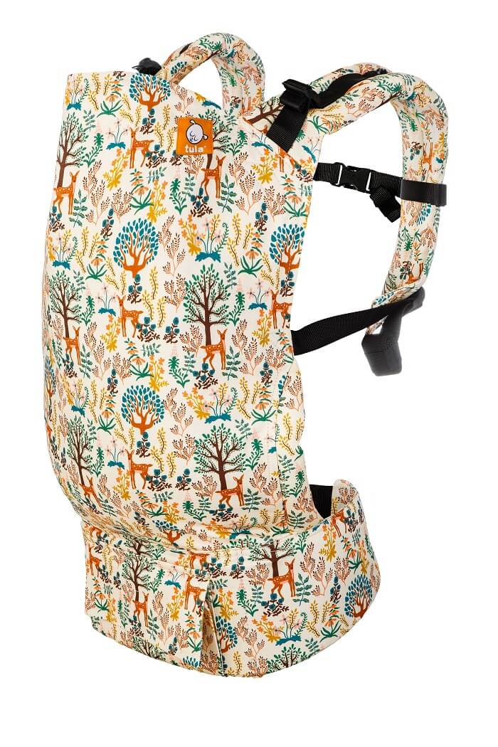 Ergonomic Preschool Carrier Charmed with a pastel beige background with blue, green, coral and brown deer and plant pattern by Baby Tula.