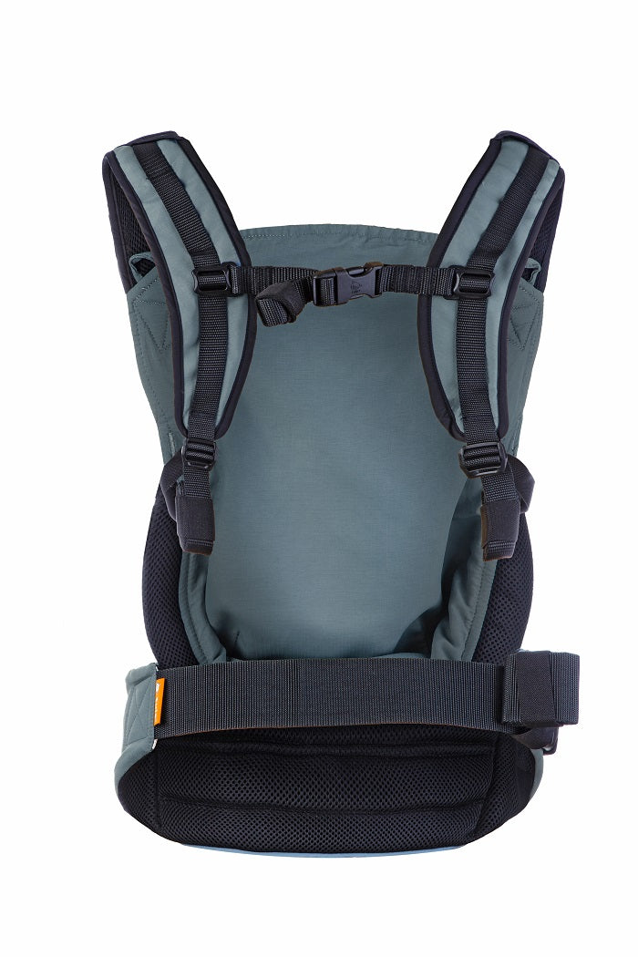 The Tula Lite Compact Travel Carrier Slate in blue, visible from the back.