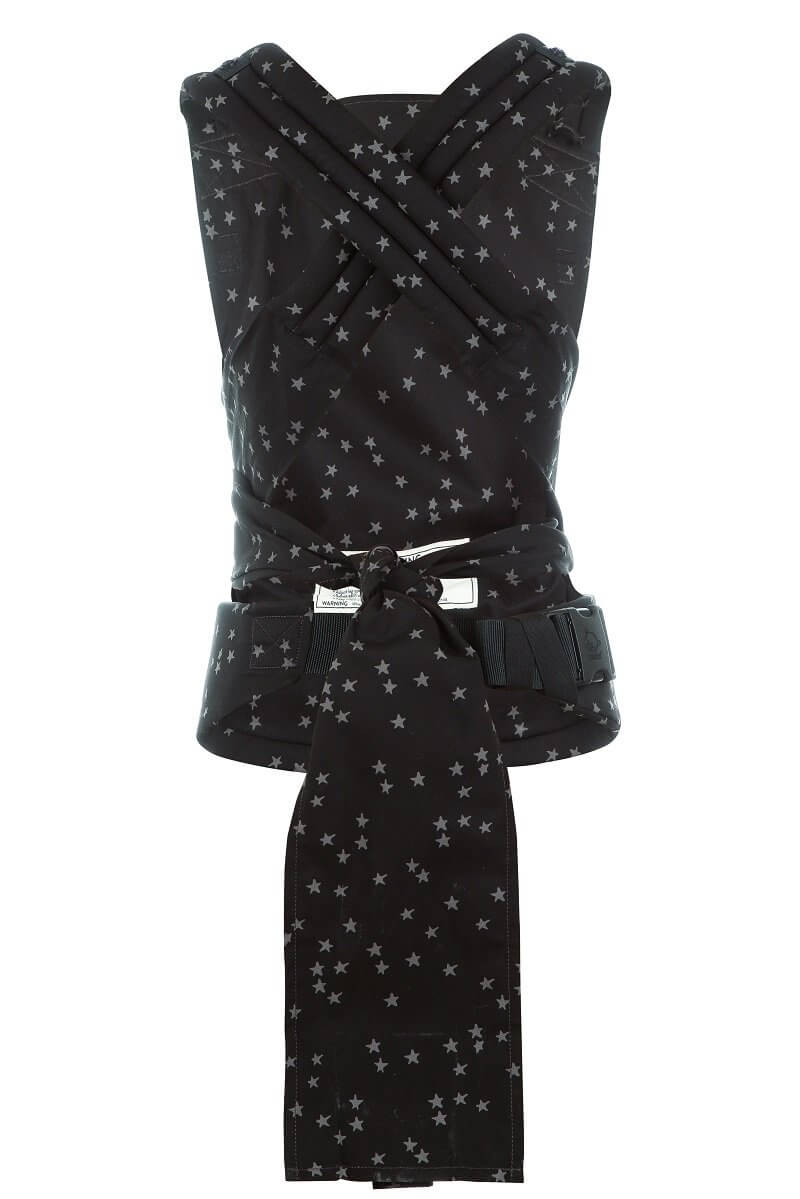 The Tula Half Buckle Carrier Discover in black with grey stars visible from the back.